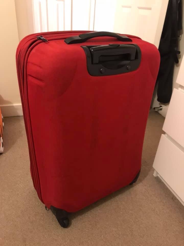 1 x large red suitcase